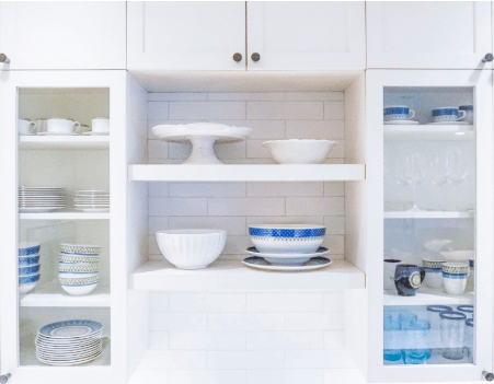 White Shelves with White and Blue Dishes Neatly Stacked