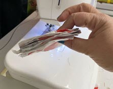 plastic bag with sewing machine in background