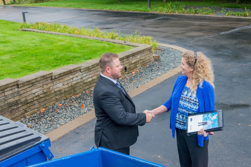 Republic Services Sales Rep with a customer