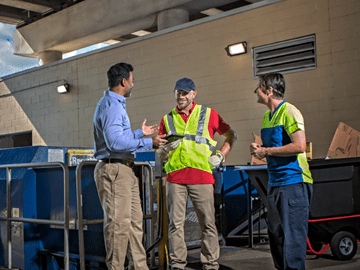 three employees talking
