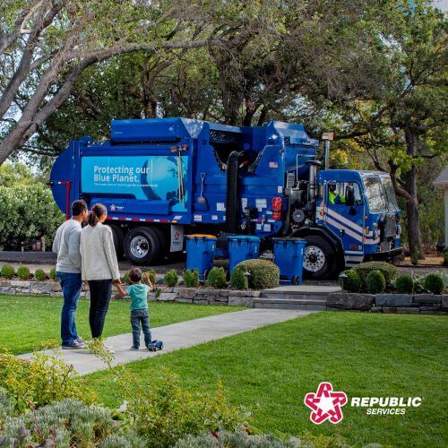 family watches the trash truck