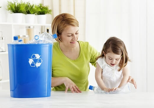 Mother and daughter learning to recycle