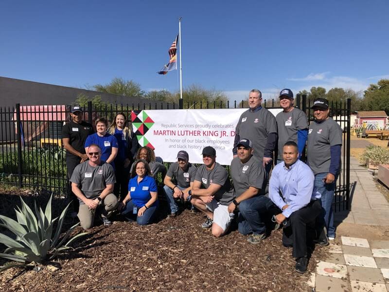 group photo in front of an MLK banner