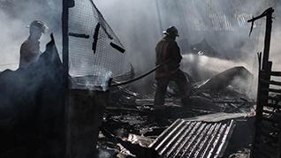 Firefighter extinguishing a fire 