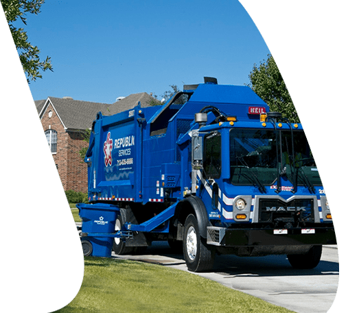 Blue trash truck picks residential neighborhood