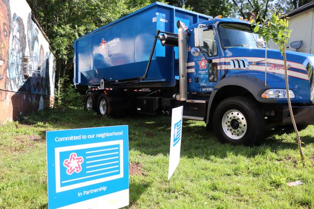 blue Republic Services truck parked on grass
