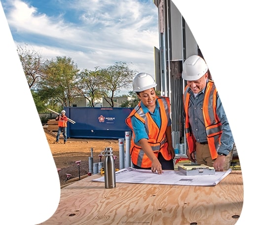 Construction workers looking at plans