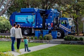 family watches the trash truck