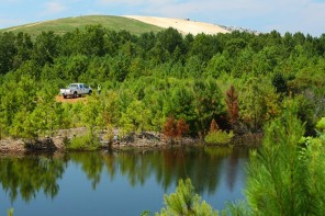 Landscape with truck, lake, and landfill