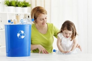 Mother and daughter learning to recycle