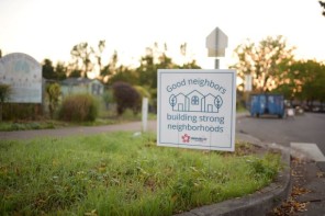 Good neighbors sign in grass 