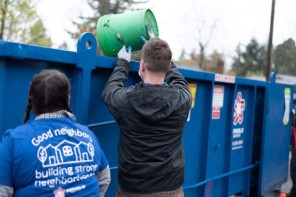 volunteers using dumpsters
