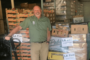 L.A. Zoo Curator standing in front of produce