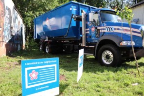 blue Republic Services truck parked on grass