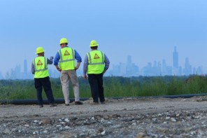 Three workers looking at the skyline