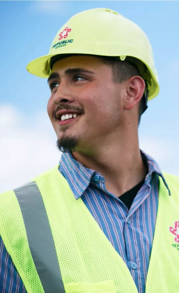 Republic Services Employee wearing hi-viz hard-hat and vest