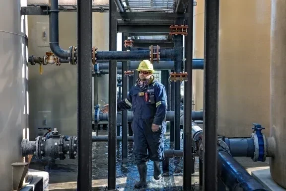 employee walking through industrial area