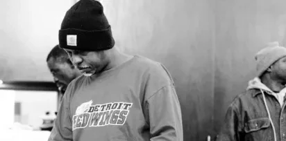 man wearing a Detroit Pistons t-shirt
